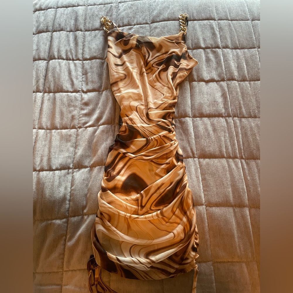 Bodycon dress with ruched sides with gold straps